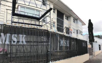 Why do construction workers put up fences around the construction site?